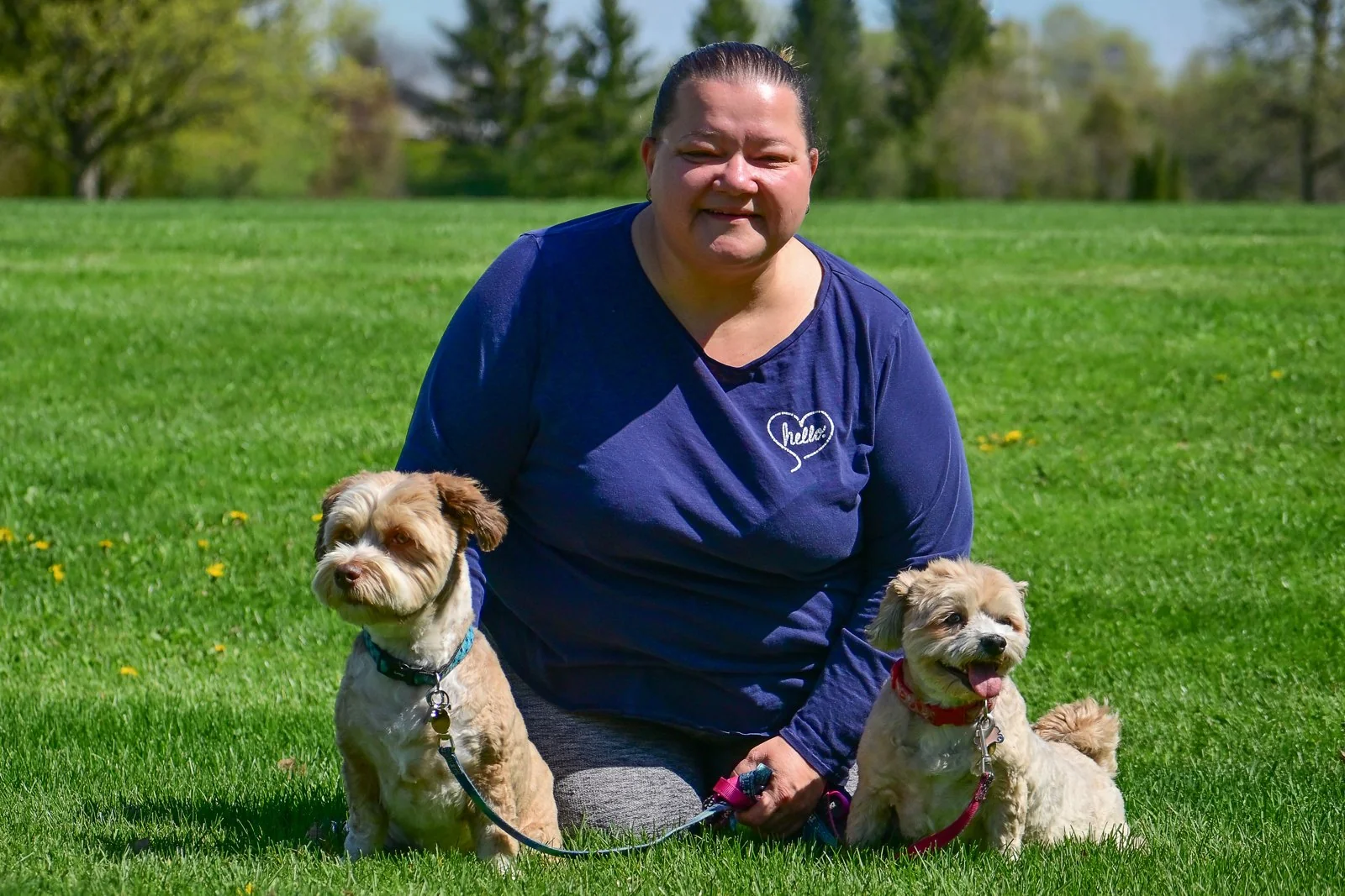 A dog owner with her two dogs at a BetterDog Pack Walk