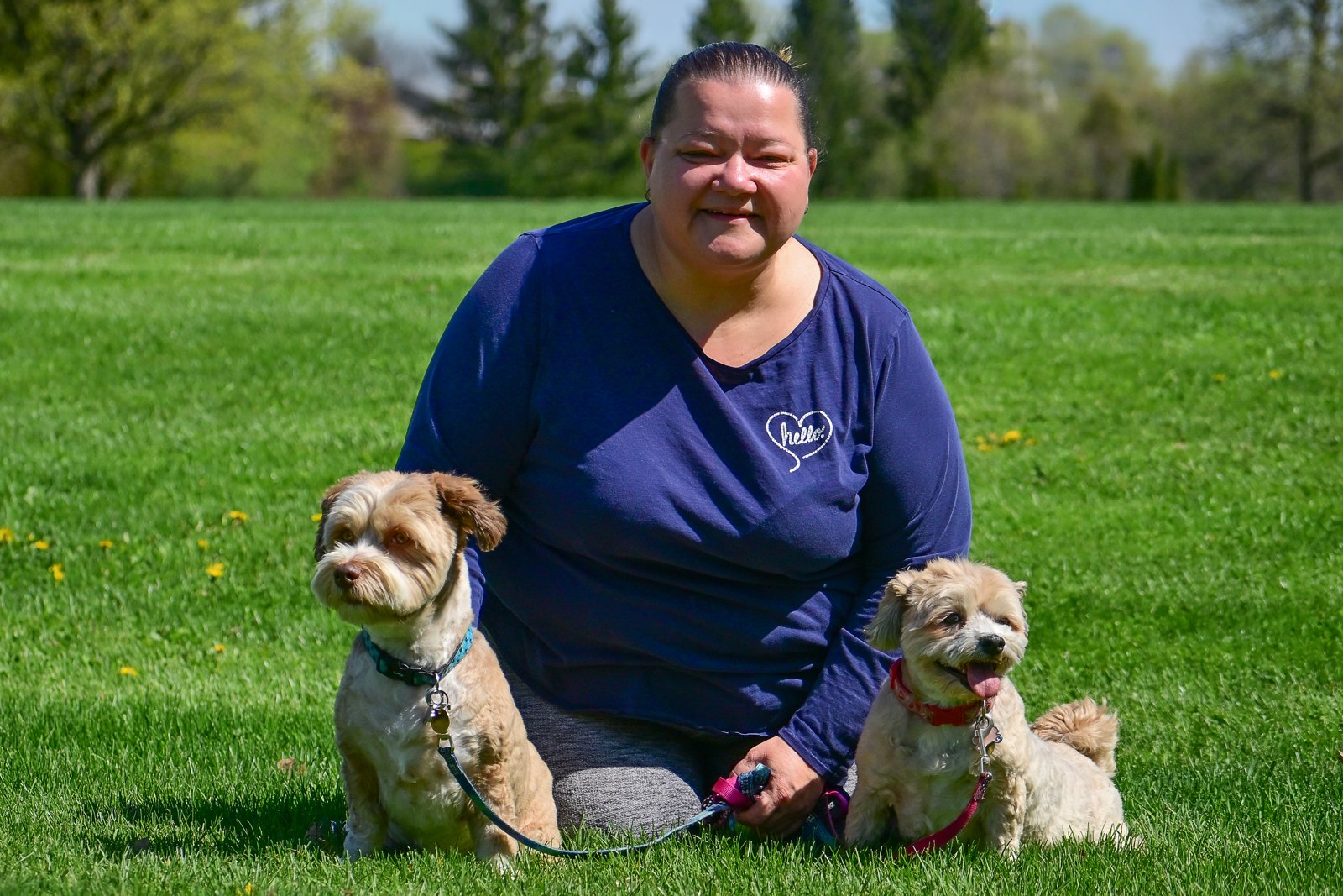 A dog owner with her two dogs at a BetterDog Pack Walk